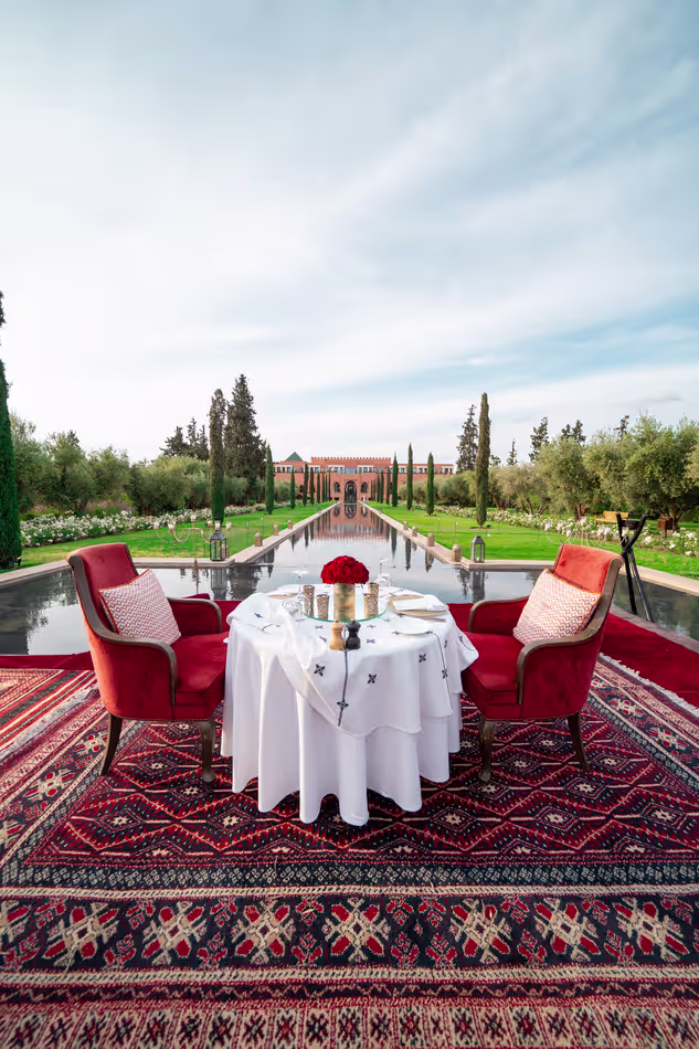 Romantic candlelit dinner setup by a resort pool